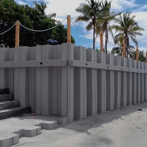 Steel sheet pile installation with a crane in a coastal area